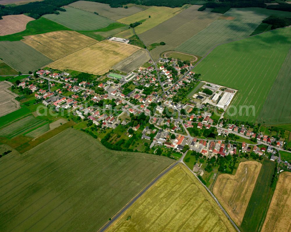 Ponickau from the bird's eye view: Agricultural land and field boundaries surround the settlement area of the village in Ponickau in the state Saxony, Germany