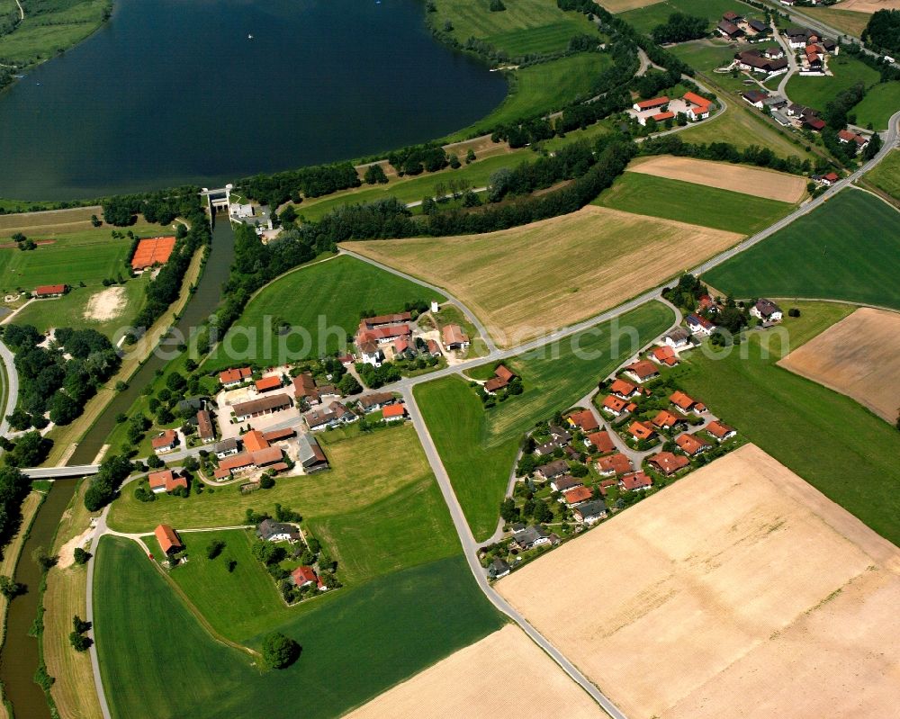 Aerial image Postmünster - Agricultural land and field boundaries surround the settlement area of the village in Postmünster in the state Bavaria, Germany