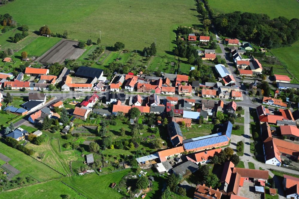 Aerial photograph Potzehne - Agricultural land and field boundaries surround the settlement area of the village in Potzehne in the state Saxony-Anhalt, Germany