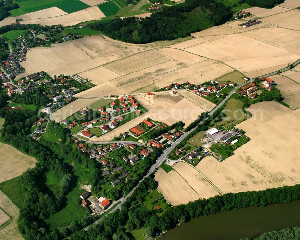 Prienbach from above - Agricultural land and field boundaries surround the settlement area of the village in Prienbach in the state Bavaria, Germany