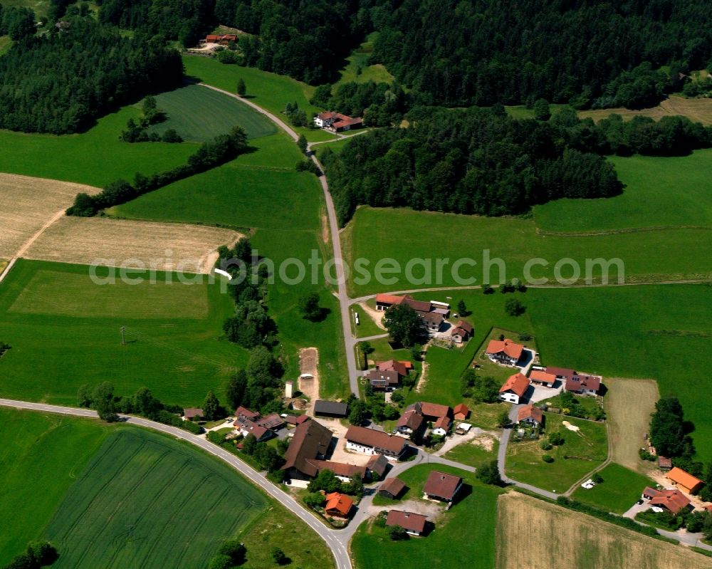 Prünstfehlburg from above - Agricultural land and field boundaries surround the settlement area of the village in Prünstfehlburg in the state Bavaria, Germany