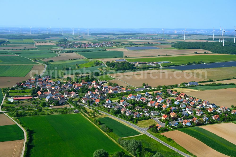 Aerial image Püssensheim - Agricultural land and field boundaries surround the settlement area of the village in Püssensheim in the state Bavaria, Germany