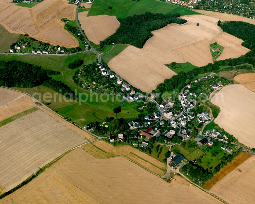 Raasdorf from the bird's eye view: Agricultural land and field boundaries surround the settlement area of the village in Raasdorf in the state Thuringia, Germany