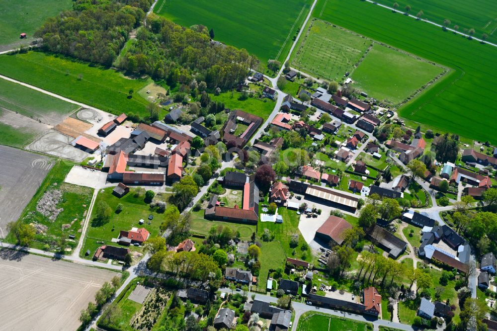 Aerial image Rade - Agricultural land and field boundaries surround the settlement area of the village in Rade in the state Lower Saxony, Germany