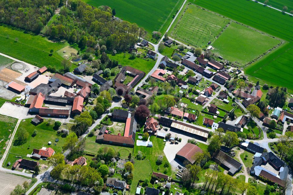 Aerial photograph Rade - Agricultural land and field boundaries surround the settlement area of the village in Rade in the state Lower Saxony, Germany