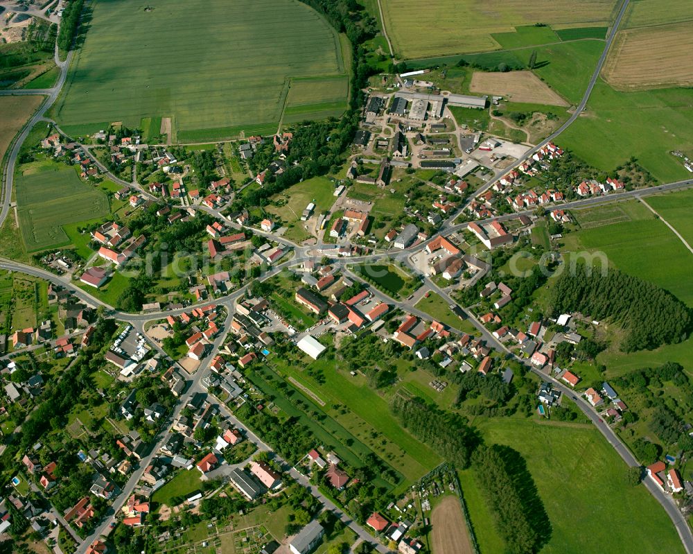 Aerial image Radewitz - Agricultural land and field boundaries surround the settlement area of the village in Radewitz in the state Saxony, Germany