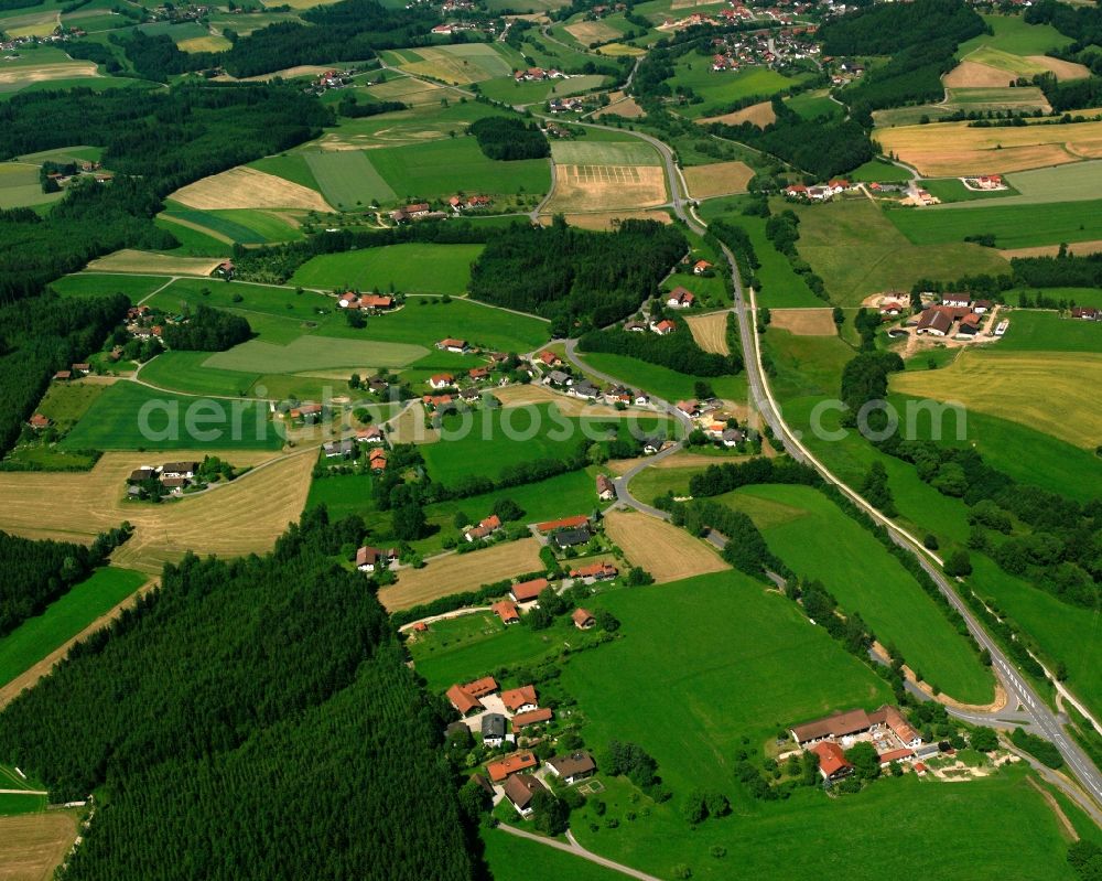 Radmoos from the bird's eye view: Agricultural land and field boundaries surround the settlement area of the village in Radmoos in the state Bavaria, Germany