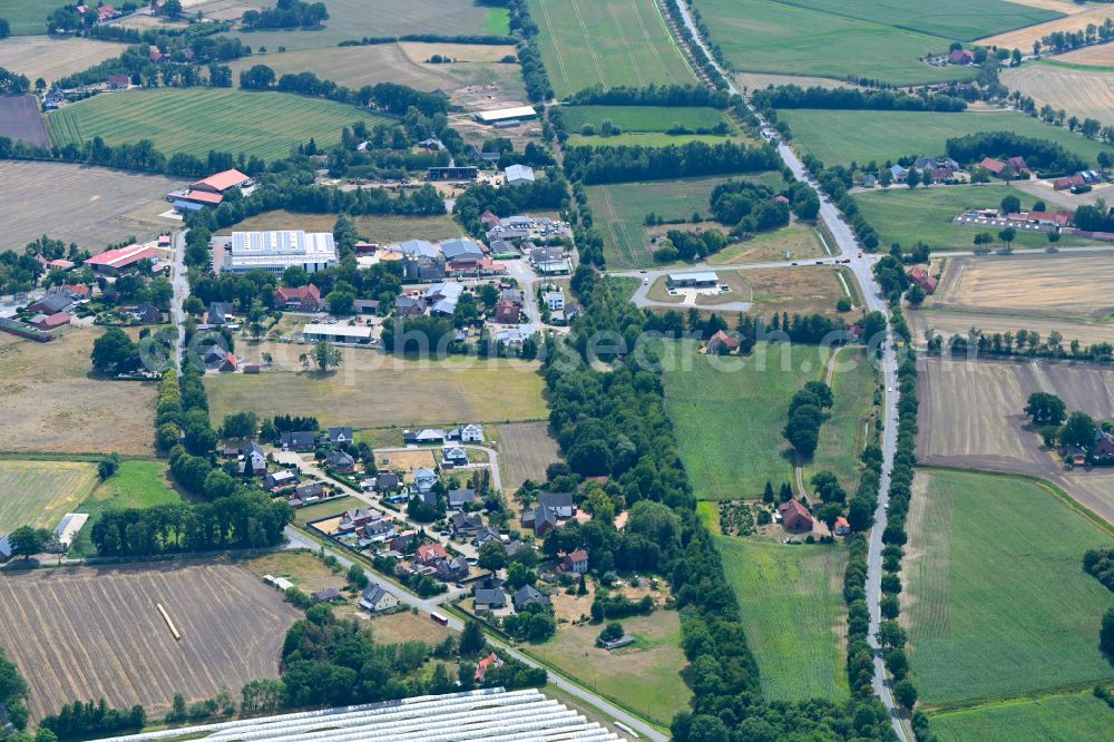 Rahden from the bird's eye view: Agricultural land and field boundaries surround the settlement area of the village in Rahden in the state North Rhine-Westphalia, Germany