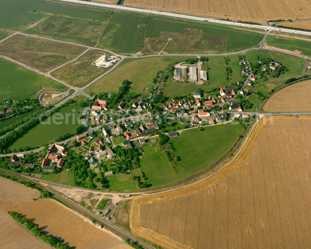 Raitzhain from the bird's eye view: Agricultural land and field boundaries surround the settlement area of the village in Raitzhain in the state Thuringia, Germany