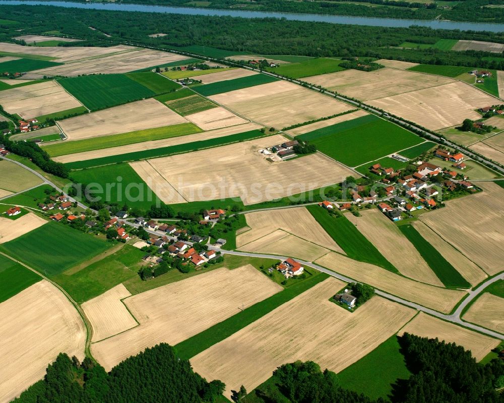 Aerial photograph Ramerding - Agricultural land and field boundaries surround the settlement area of the village in Ramerding in the state Bavaria, Germany