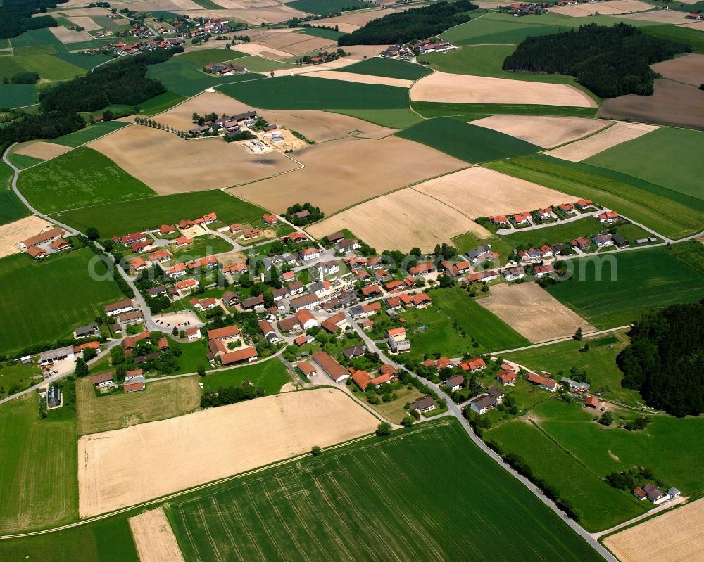 Rattenbach from above - Agricultural land and field boundaries surround the settlement area of the village in Rattenbach in the state Bavaria, Germany