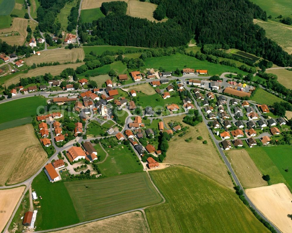 Aerial image Rattiszell - Agricultural land and field boundaries surround the settlement area of the village in Rattiszell in the state Bavaria, Germany