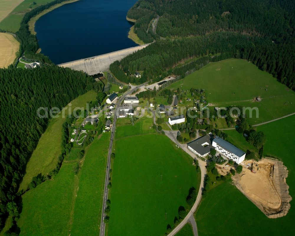 Rauschenbach from above - Agricultural land and field boundaries surround the settlement area of the village in Rauschenbach in the state Saxony, Germany