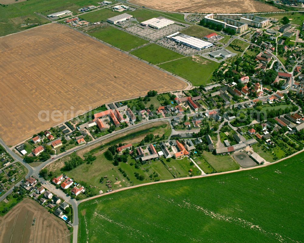 Aerial image Röderau-Bobersen - Agricultural land and field boundaries surround the settlement area of the village in Röderau-Bobersen in the state Saxony, Germany