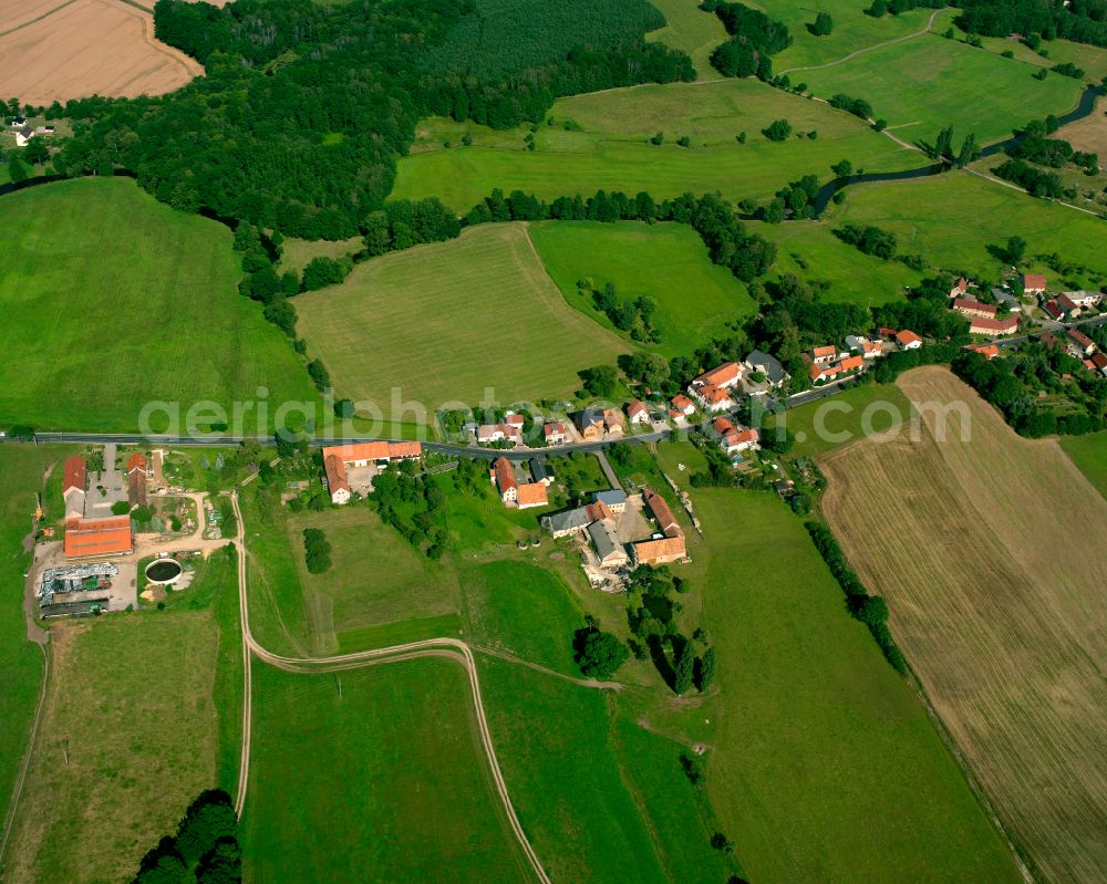 Rödern from above - Agricultural land and field boundaries surround the settlement area of the village in Rödern in the state Saxony, Germany