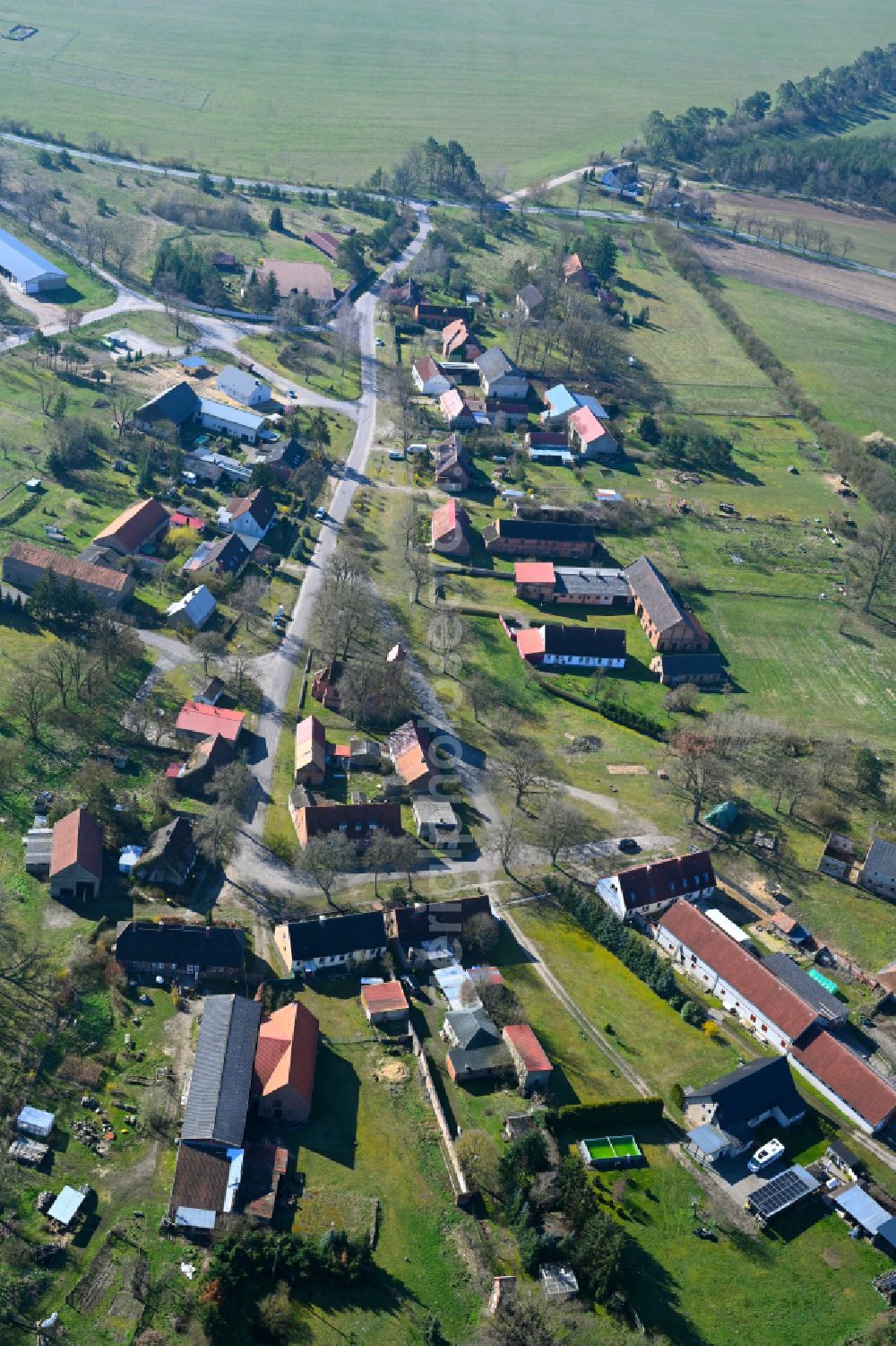 Redlin from above - Agricultural land and field boundaries surround the settlement area of the village in Redlin in the state Mecklenburg - Western Pomerania, Germany