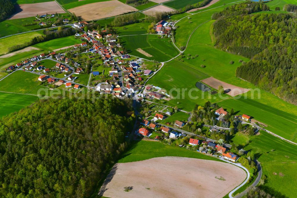 Aerial photograph Rehweiler - Agricultural land and field boundaries surround the settlement area of the village in Rehweiler in the state Bavaria, Germany