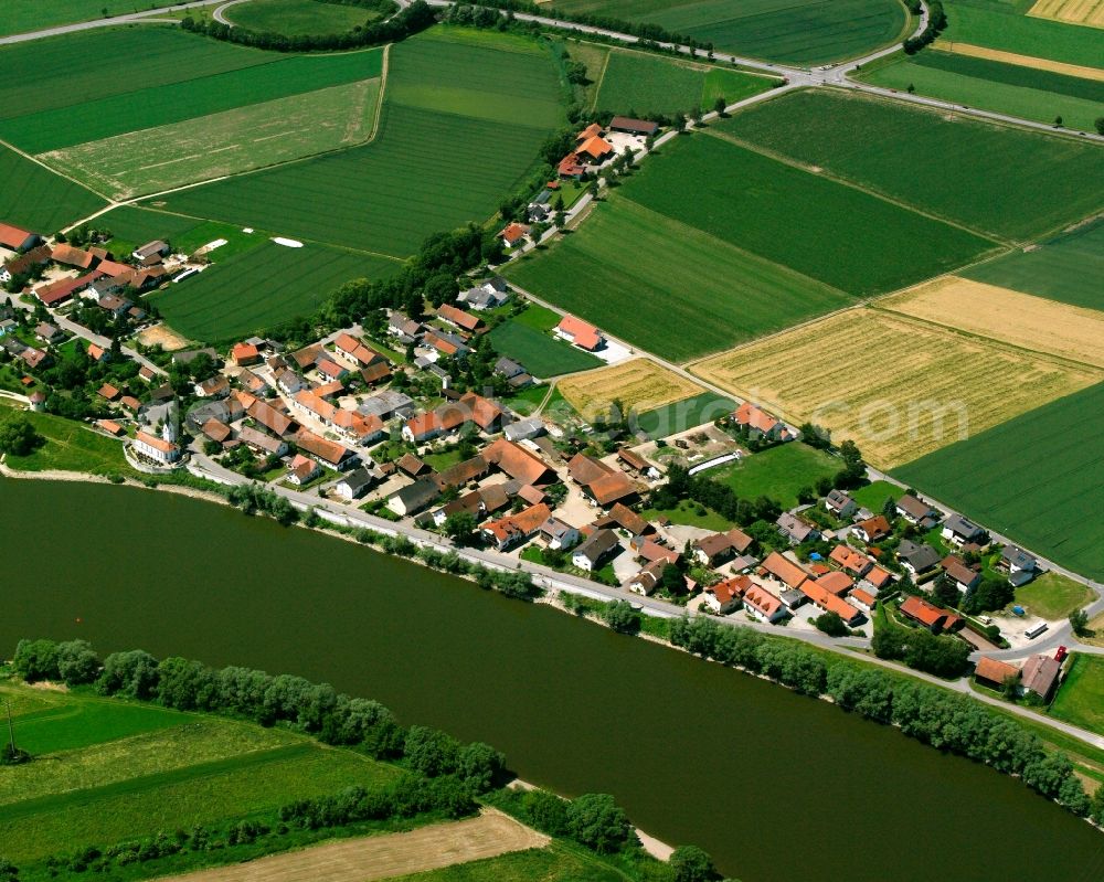 Reibersdorf from above - Agricultural land and field boundaries surround the settlement area of the village in Reibersdorf in the state Bavaria, Germany