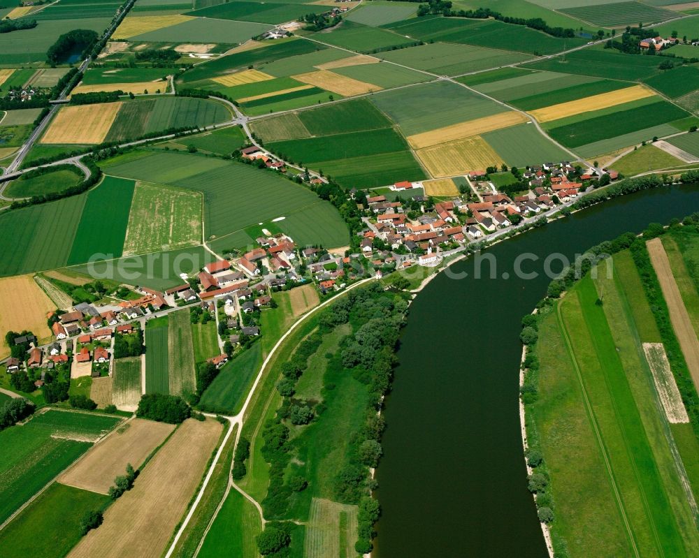 Reibersdorf from the bird's eye view: Agricultural land and field boundaries surround the settlement area of the village in Reibersdorf in the state Bavaria, Germany