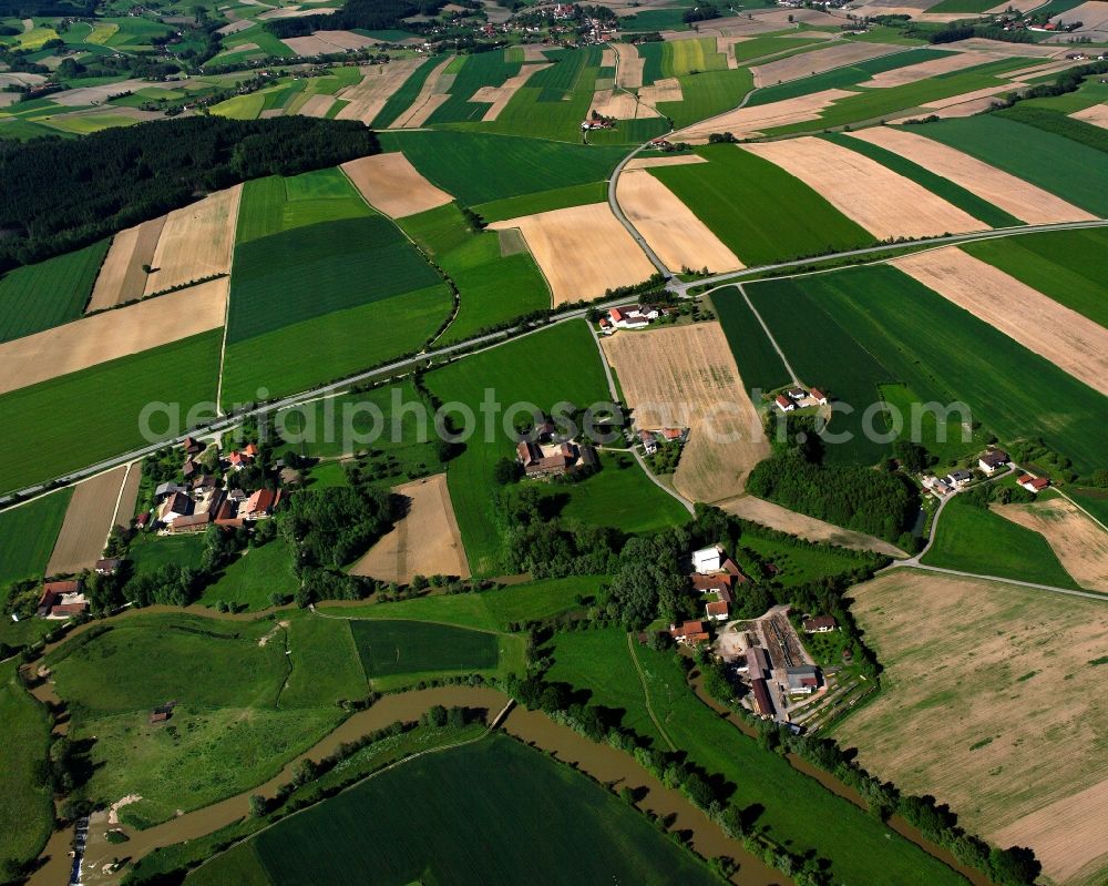 Aerial photograph Reichertsham - Agricultural land and field boundaries surround the settlement area of the village in Reichertsham in the state Bavaria, Germany