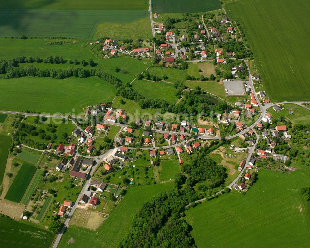 Aerial image Reichstädt - Agricultural land and field boundaries surround the settlement area of the village in Reichstädt in the state Thuringia, Germany