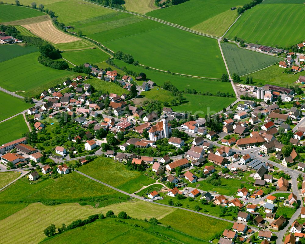 Aerial photograph Reinstetten - Agricultural land and field boundaries surround the settlement area of the village in Reinstetten in the state Baden-Wuerttemberg, Germany