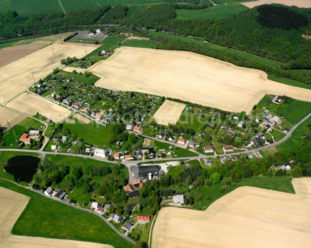 Reitzenhain from above - Agricultural land and field boundaries surround the settlement area of the village in Reitzenhain in the state Saxony, Germany