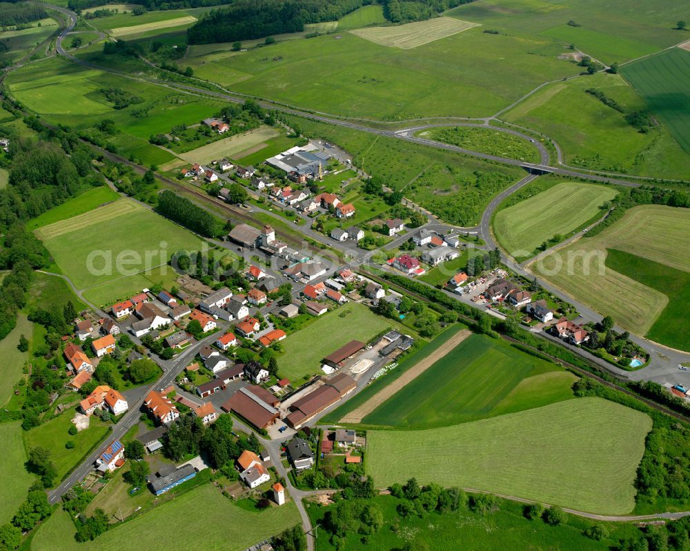 Aerial image Renzendorf - Agricultural land and field boundaries surround the settlement area of the village in Renzendorf in the state Hesse, Germany