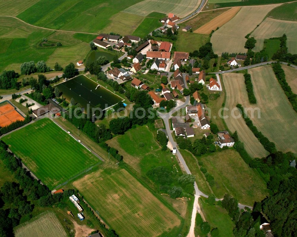 Aerial image Retzendorf - Agricultural land and field boundaries surround the settlement area of the village in Retzendorf in the state Bavaria, Germany