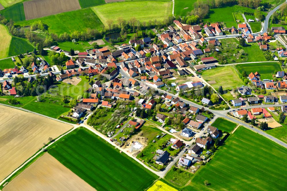 Reupelsdorf from the bird's eye view: Agricultural land and field boundaries surround the settlement area of the village in Reupelsdorf in the state Bavaria, Germany