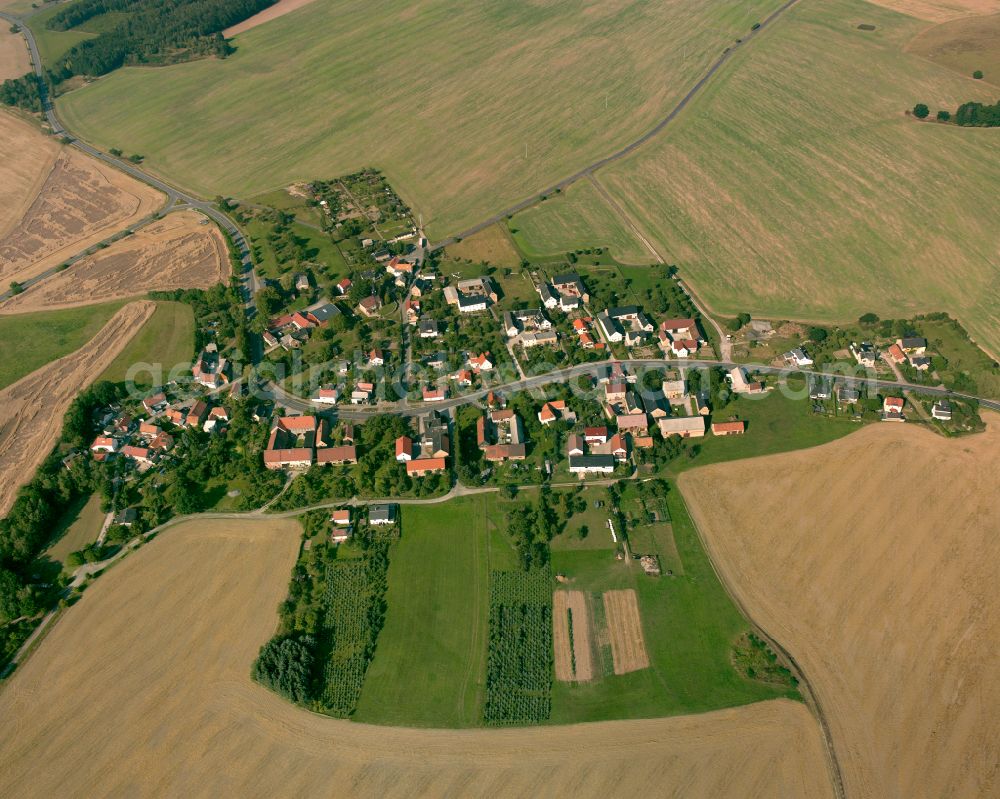 Aerial image Reust - Agricultural land and field boundaries surround the settlement area of the village in Reust in the state Thuringia, Germany