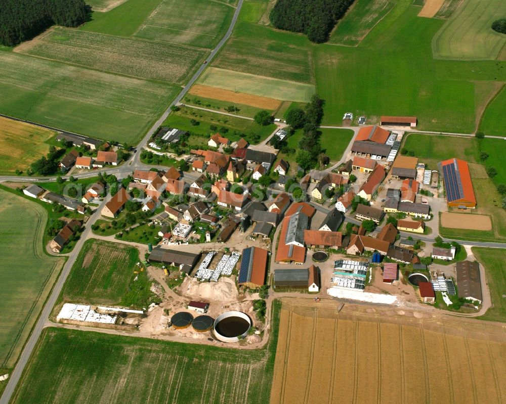 Aerial image Reuth - Agricultural land and field boundaries surround the settlement area of the village in Reuth in the state Bavaria, Germany