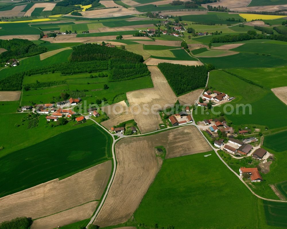 Aerial image Reuth - Agricultural land and field boundaries surround the settlement area of the village in Reuth in the state Bavaria, Germany