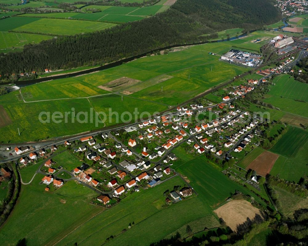 Aerial image Röhrigshof - Agricultural land and field boundaries surround the settlement area of the village in Röhrigshof in the state Hesse, Germany