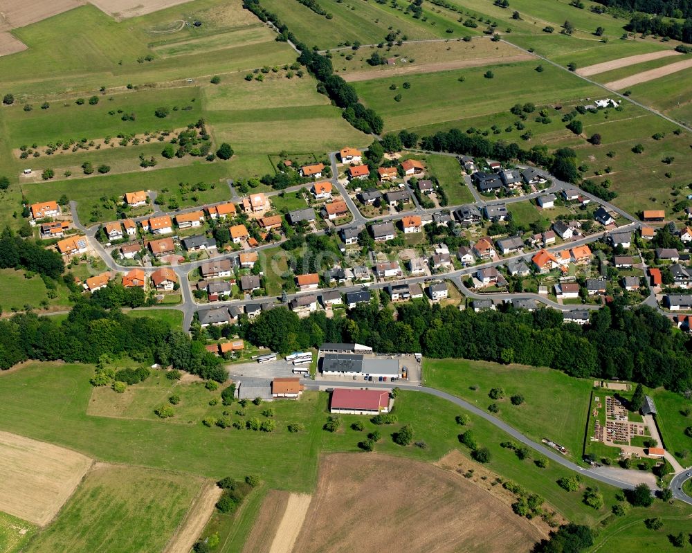 Aerial photograph Rimhorn - Agricultural land and field boundaries surround the settlement area of the village in Rimhorn in the state Hesse, Germany