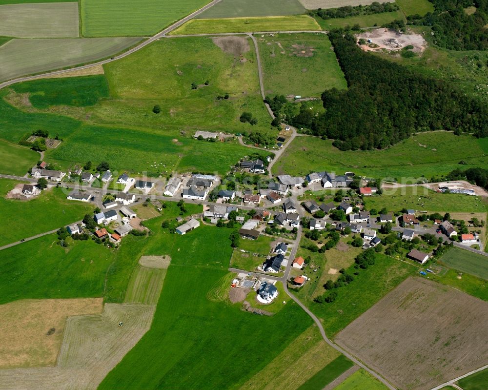 Aerial photograph Rimsberg - Agricultural land and field boundaries surround the settlement area of the village in Rimsberg in the state Rhineland-Palatinate, Germany