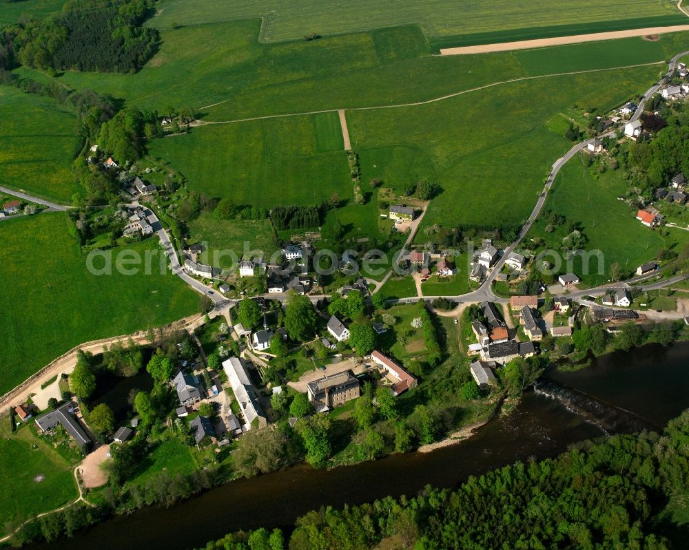 Ringethal from above - Agricultural land and field boundaries surround the settlement area of the village in Ringethal in the state Saxony, Germany