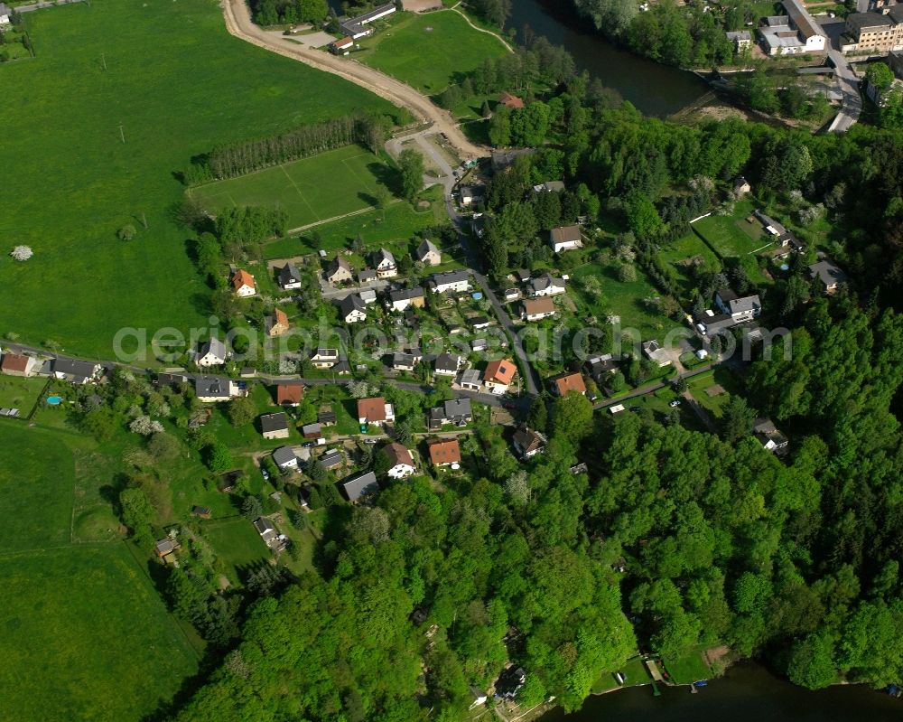 Ringethal from the bird's eye view: Agricultural land and field boundaries surround the settlement area of the village in Ringethal in the state Saxony, Germany