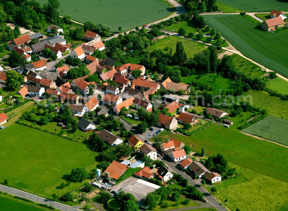 Aerial photograph Rittersheim - Agricultural land and field boundaries surround the settlement area of the village in Rittersheim in the state Rhineland-Palatinate, Germany