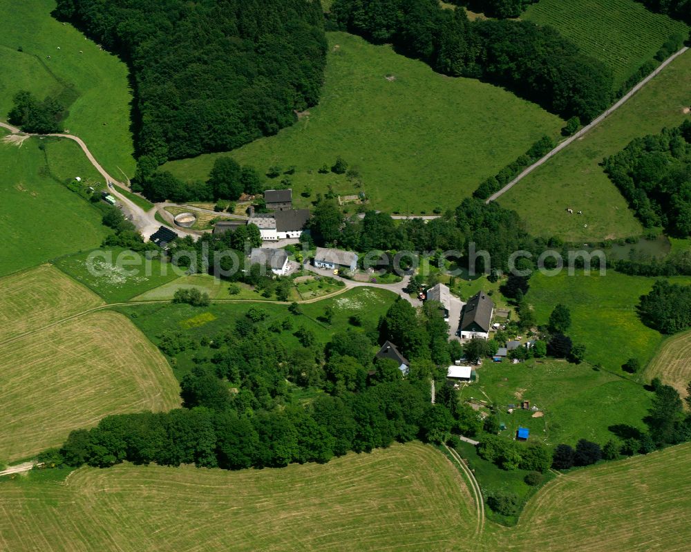 Aerial photograph Rönsahl - Agricultural land and field boundaries surround the settlement area of the village in Rönsahl in the state North Rhine-Westphalia, Germany