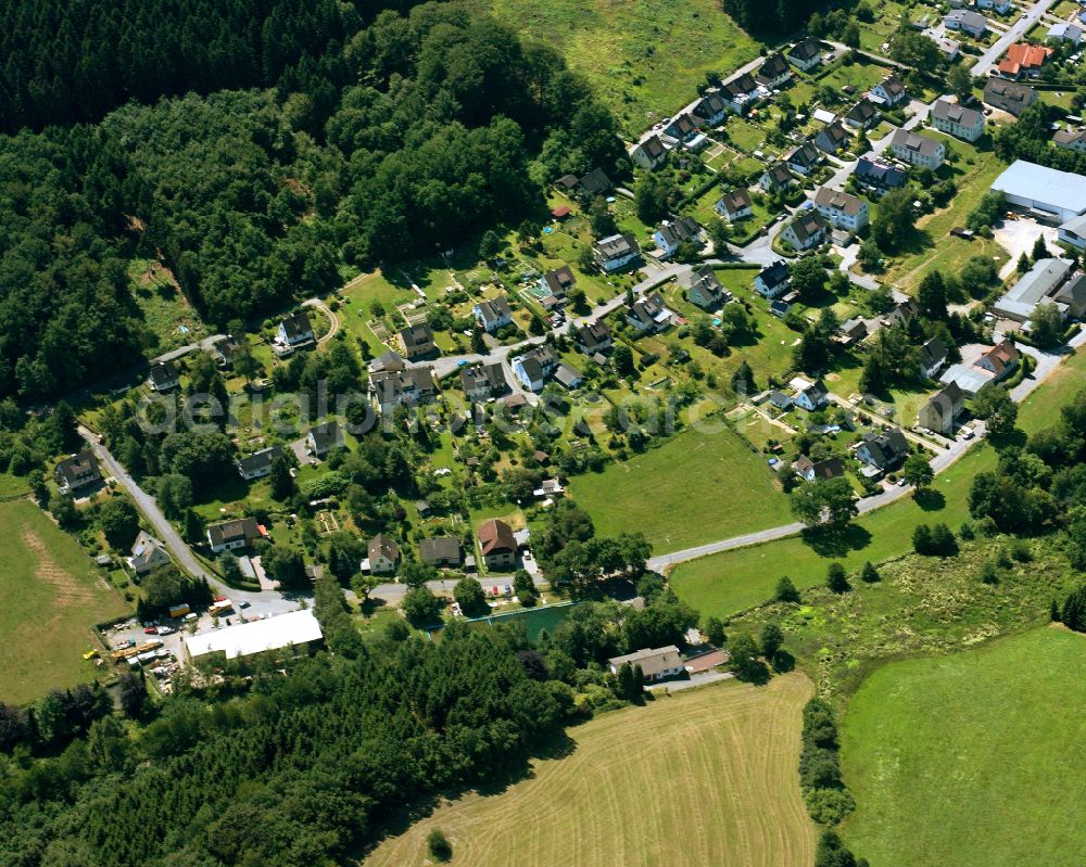 Aerial image Rönsahl - Agricultural land and field boundaries surround the settlement area of the village in Rönsahl in the state North Rhine-Westphalia, Germany