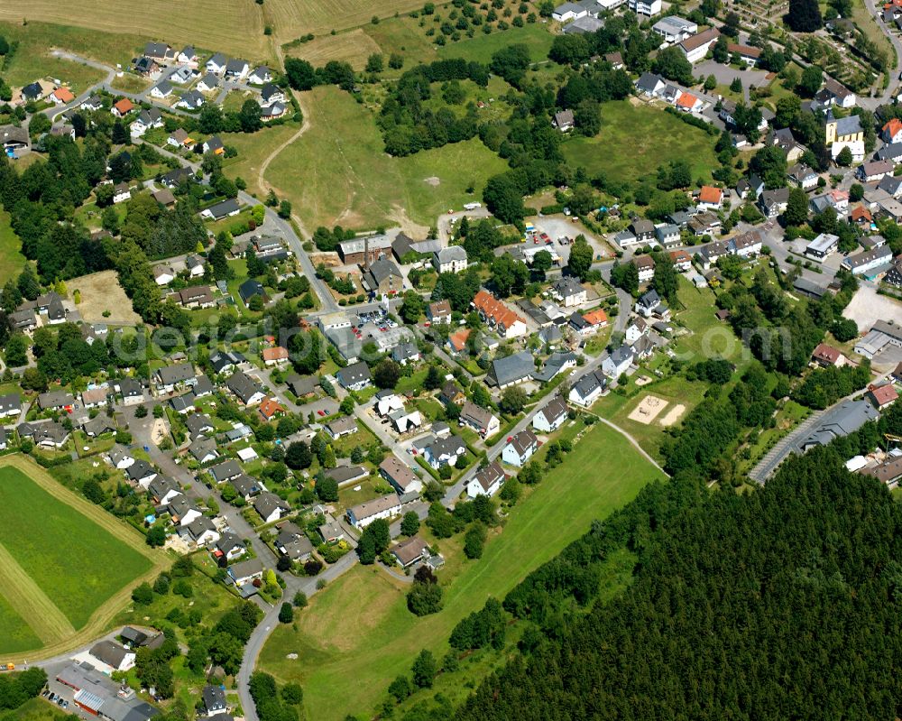 Rönsahl from above - Agricultural land and field boundaries surround the settlement area of the village in Rönsahl in the state North Rhine-Westphalia, Germany