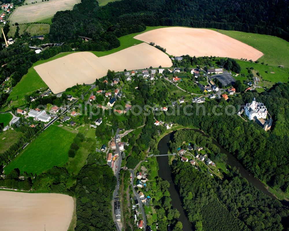 Rochsburg from above - Agricultural land and field boundaries surround the settlement area of the village in Rochsburg in the state Saxony, Germany