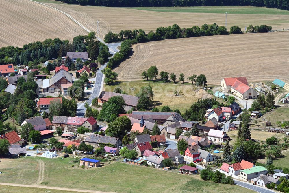 Aerial image Rodameuchel - Agricultural land and field boundaries surround the settlement area of the village in Rodameuchel in the state Thuringia, Germany