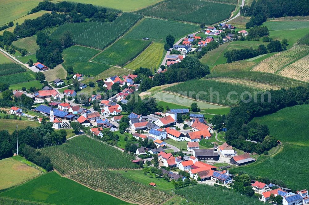 Rohr from above - Agricultural land and field boundaries surround the settlement area of the village in Rohr in the state Bavaria, Germany