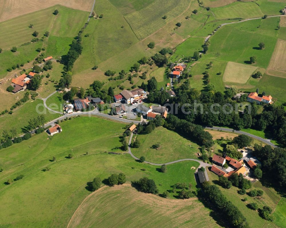 Aerial image Rohrbach - Agricultural land and field boundaries surround the settlement area of the village in Rohrbach in the state Hesse, Germany