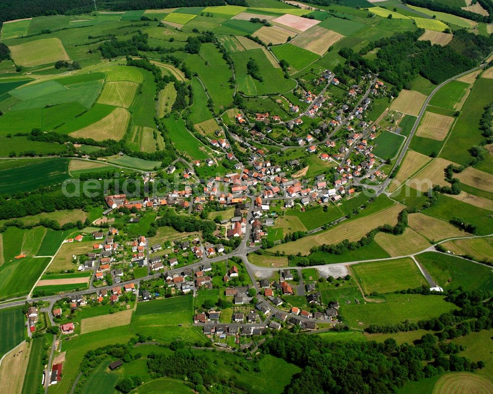 Aerial image Rohrbach - Agricultural land and field boundaries surround the settlement area of the village in Rohrbach in the state Hesse, Germany