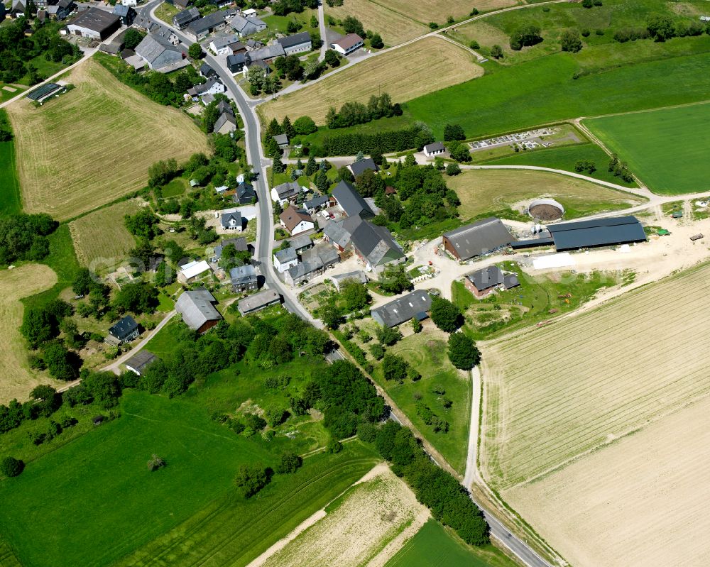 Aerial image Rohrbach - Agricultural land and field boundaries surround the settlement area of the village in Rohrbach in the state Rhineland-Palatinate, Germany