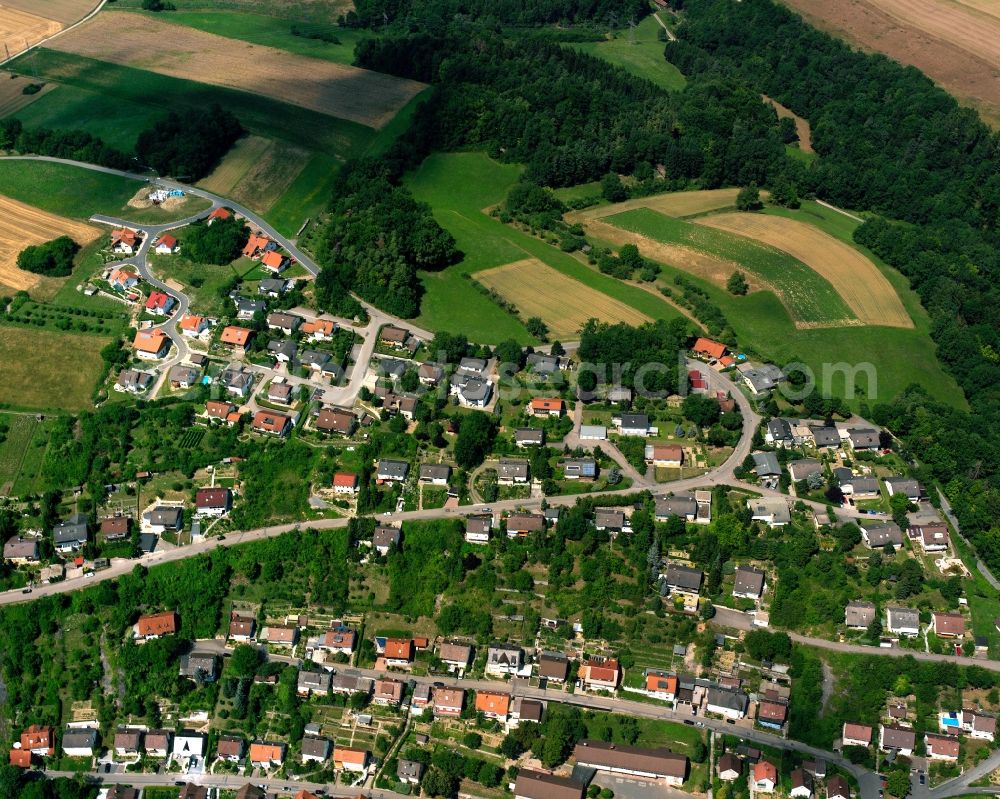 Roigheim from the bird's eye view: Agricultural land and field boundaries surround the settlement area of the village in Roigheim in the state Baden-Wuerttemberg, Germany