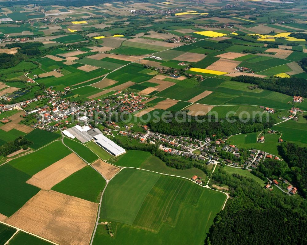 Roßbach from above - Agricultural land and field boundaries surround the settlement area of the village in Roßbach in the state Bavaria, Germany